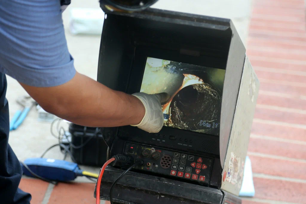 Technician viewing a drain inspection camera in Warminster